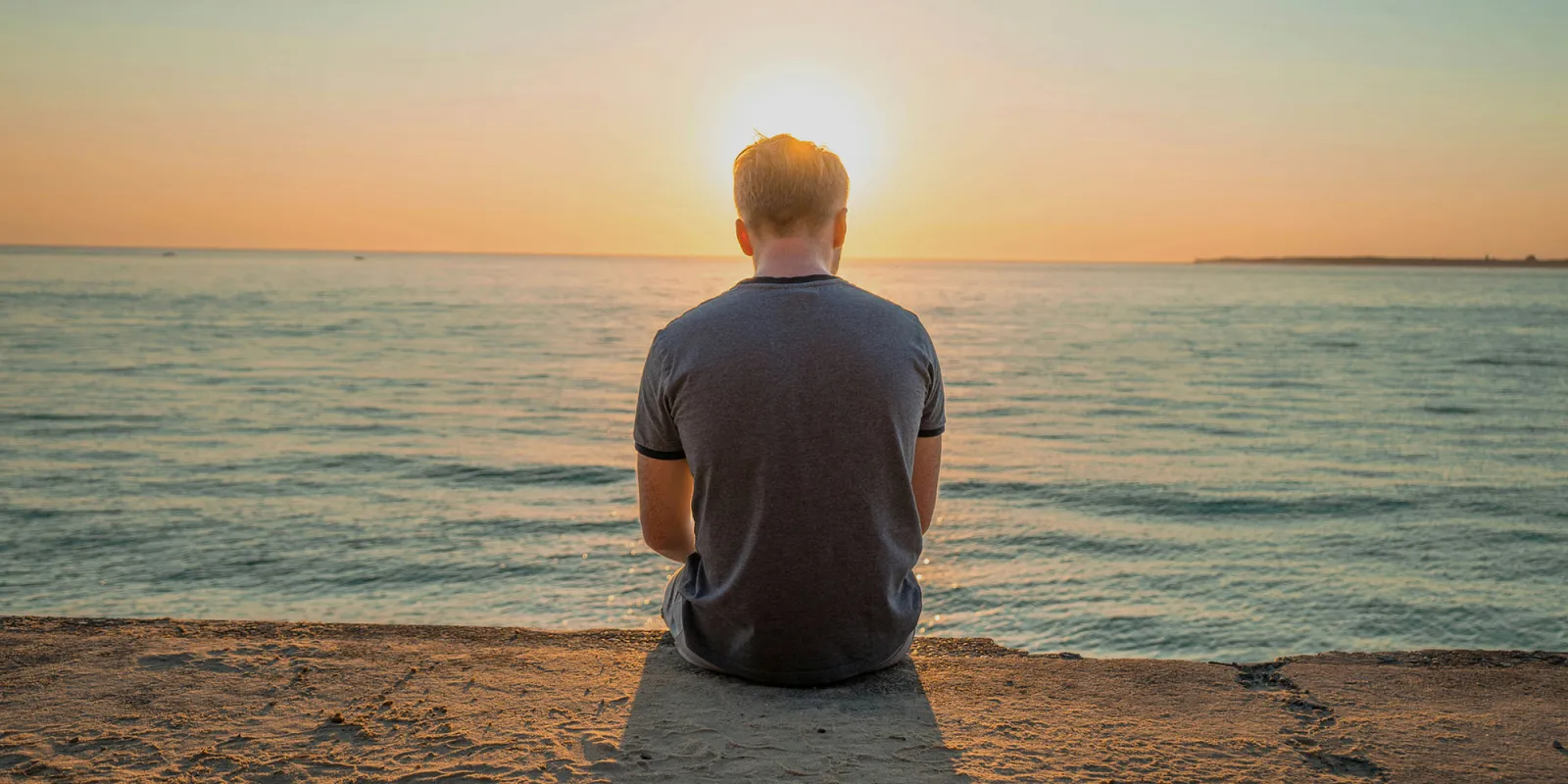 Unfollow Everything | Back of a man looking out to sea