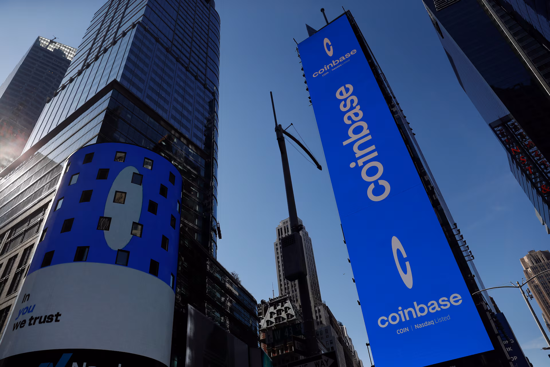 Coinbase to cut 700 jobs, citing volatility and AI