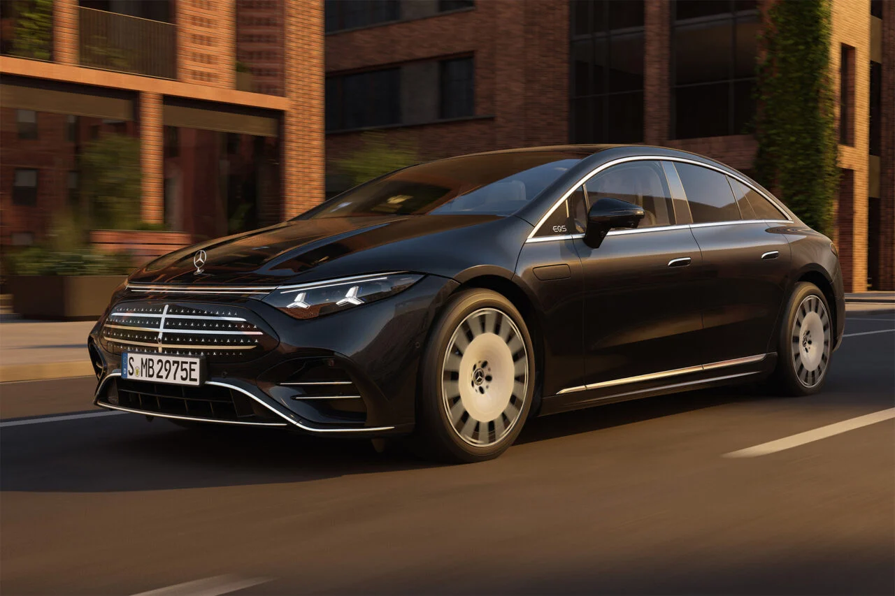 The Mercedes-Benz EQS is seen on the street from the side.