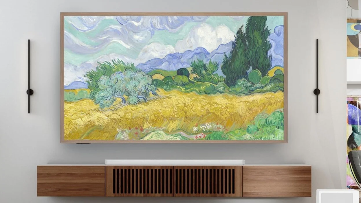 hisense canvas TV hangs in a living room displaying artwork from monet
