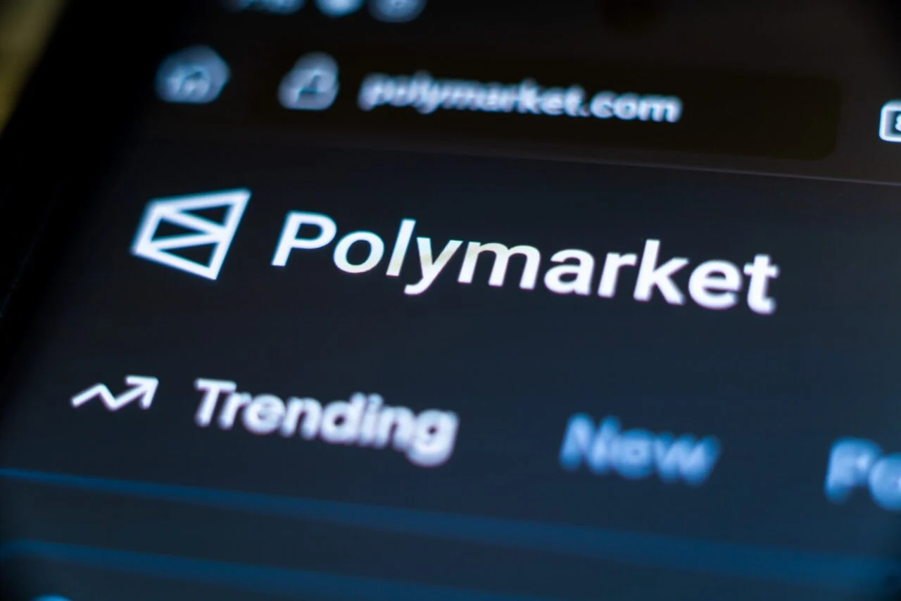 A Polymarket trading screen is seen.