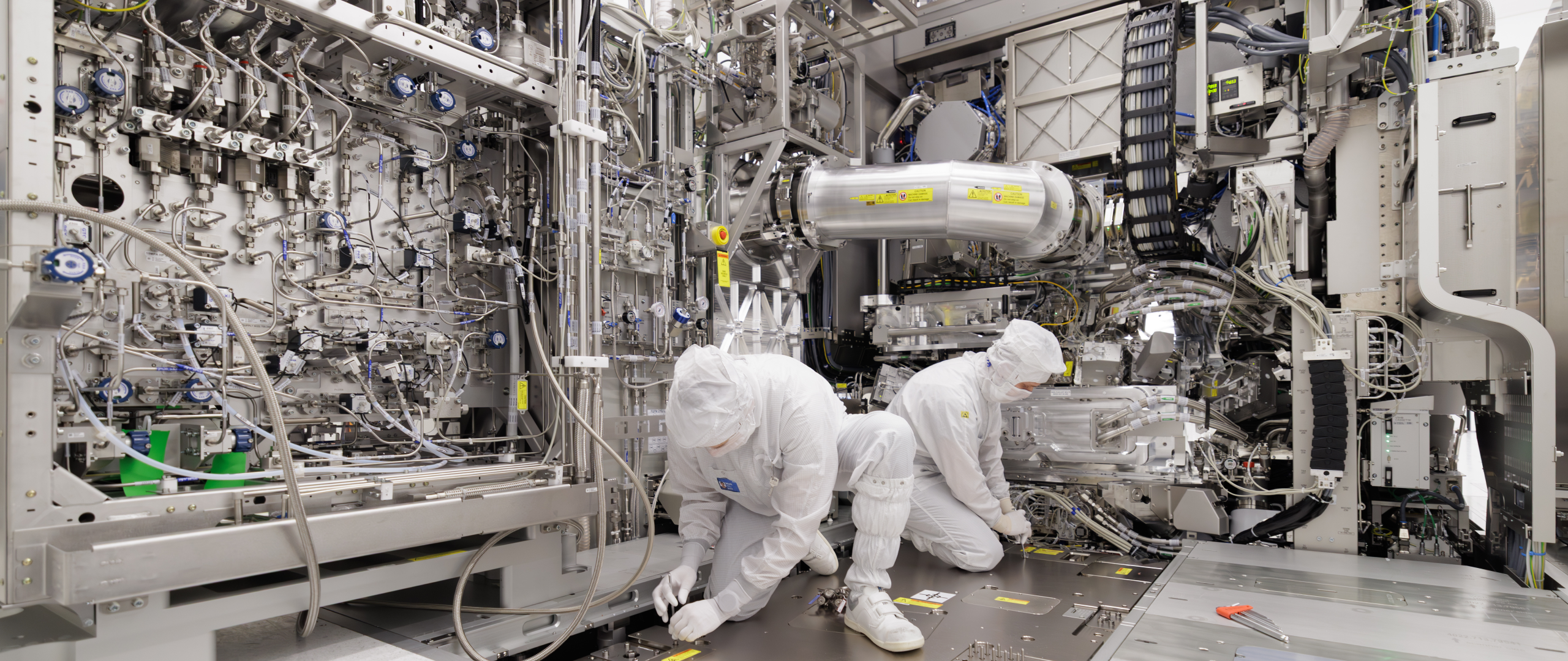 Men working on Twinscan EUV machine 