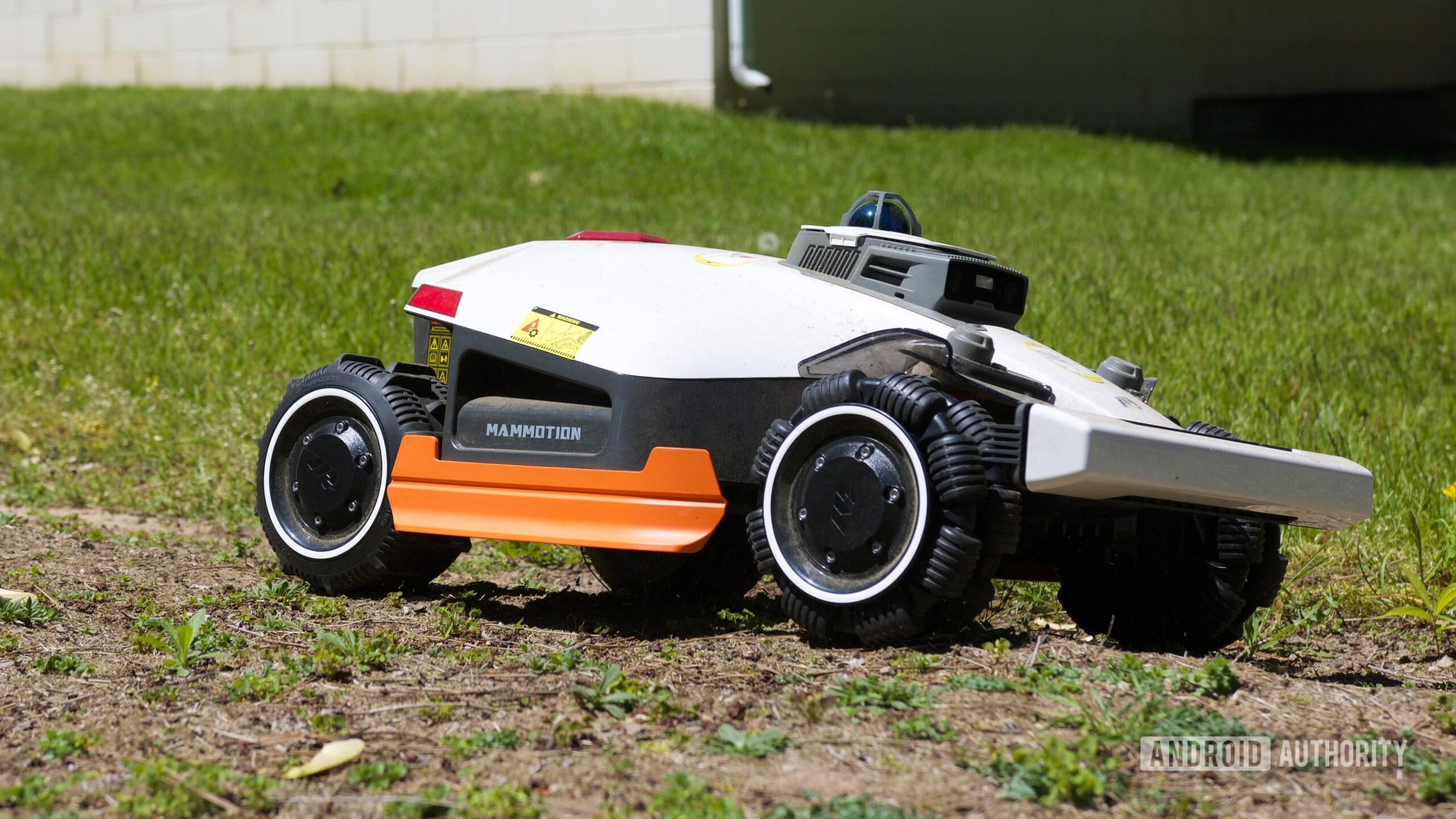 mammotion luba 3 awd review 2 The Mammotion LUBA 3 AWD mowing a yard.