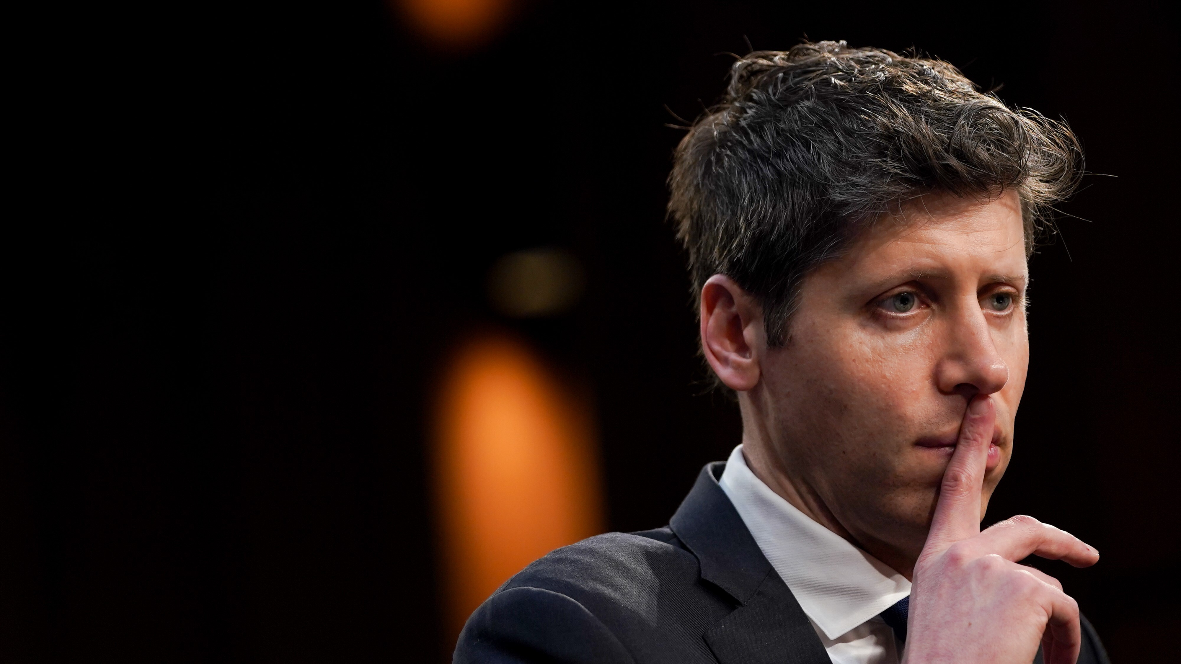 Sam Altman, CEO of OpenAI looking pensive off-camera