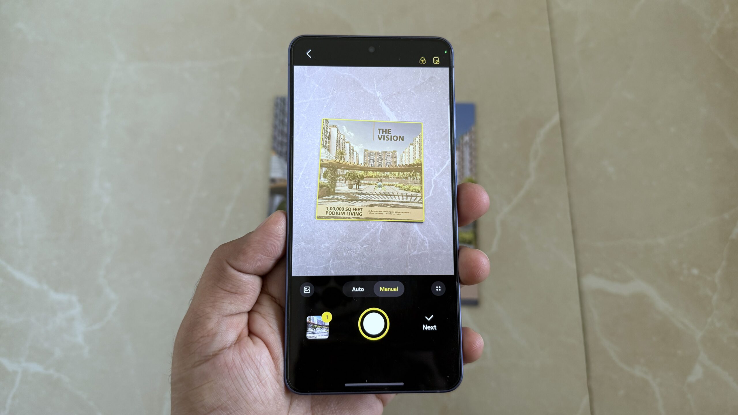 Samsung phone in hand showing scanning a document