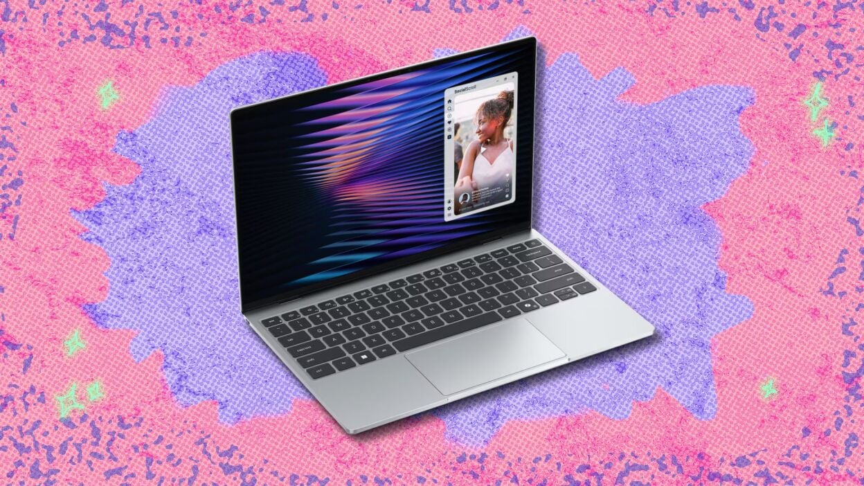 dell xps 13 laptop against a pink and purple patterned background