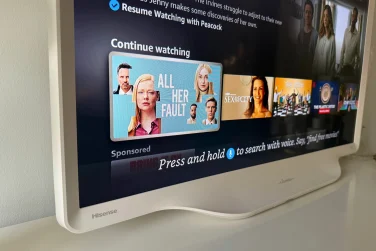 Hisense D&eacute;co TV's curved edges and Fire TV streaming apps on screen