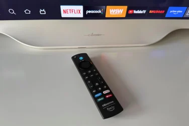 Hisense D&eacute;co TV remote laying on dresser near TV