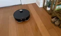 Dreame X60 Max Ultra Complete robot vacuum mopping hardwood floor near front door