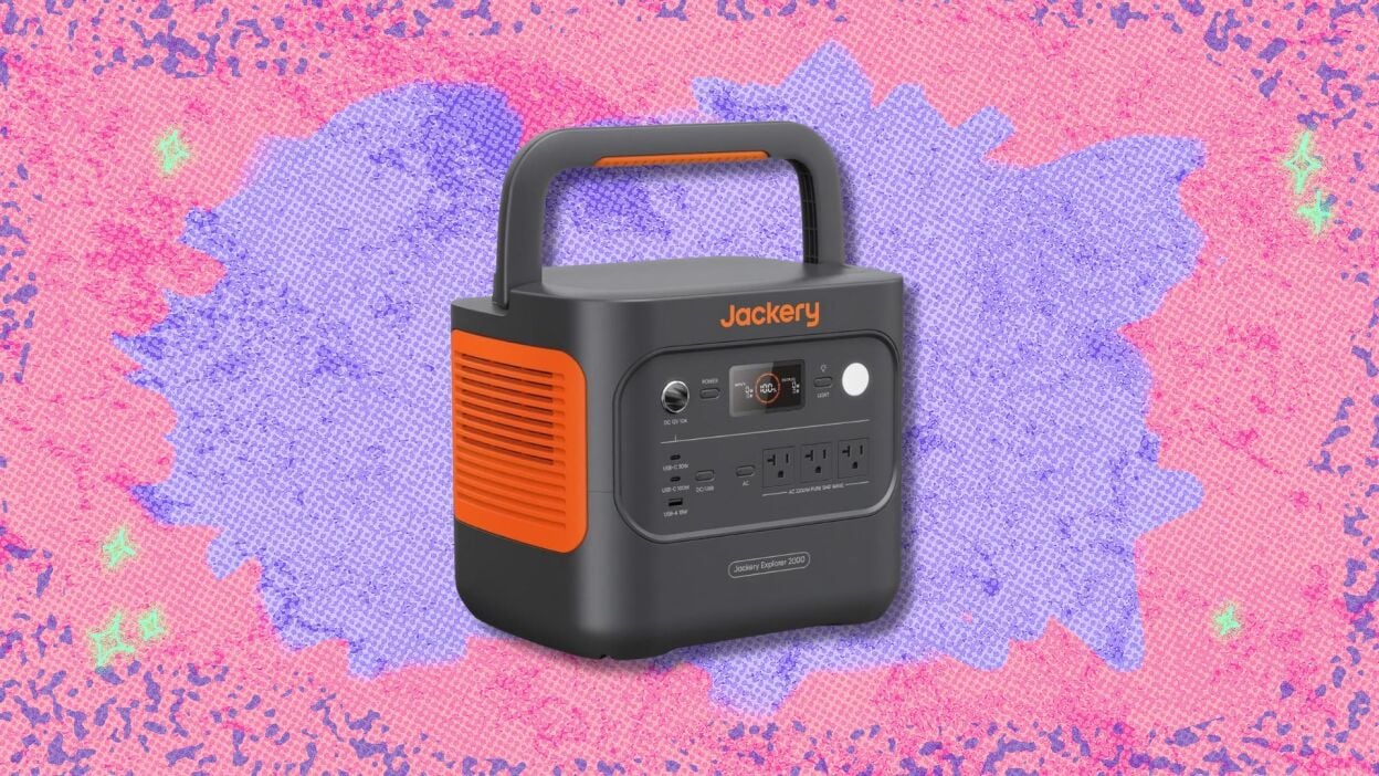 jackery explorer 2000 v2 portable power station against a pink and purple patterned background