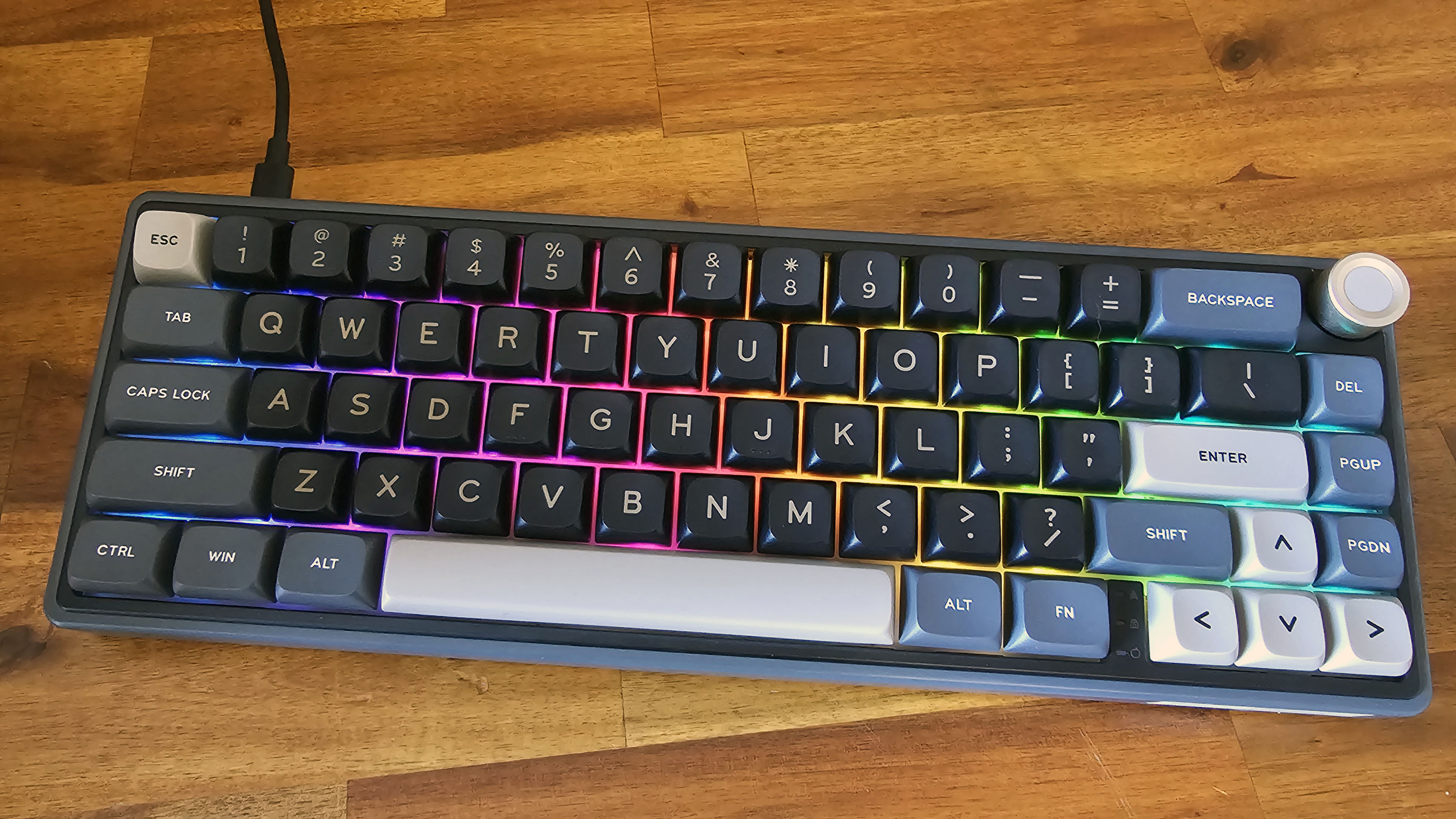 Royal Kludge R65 RGB keyboard on a wood bench