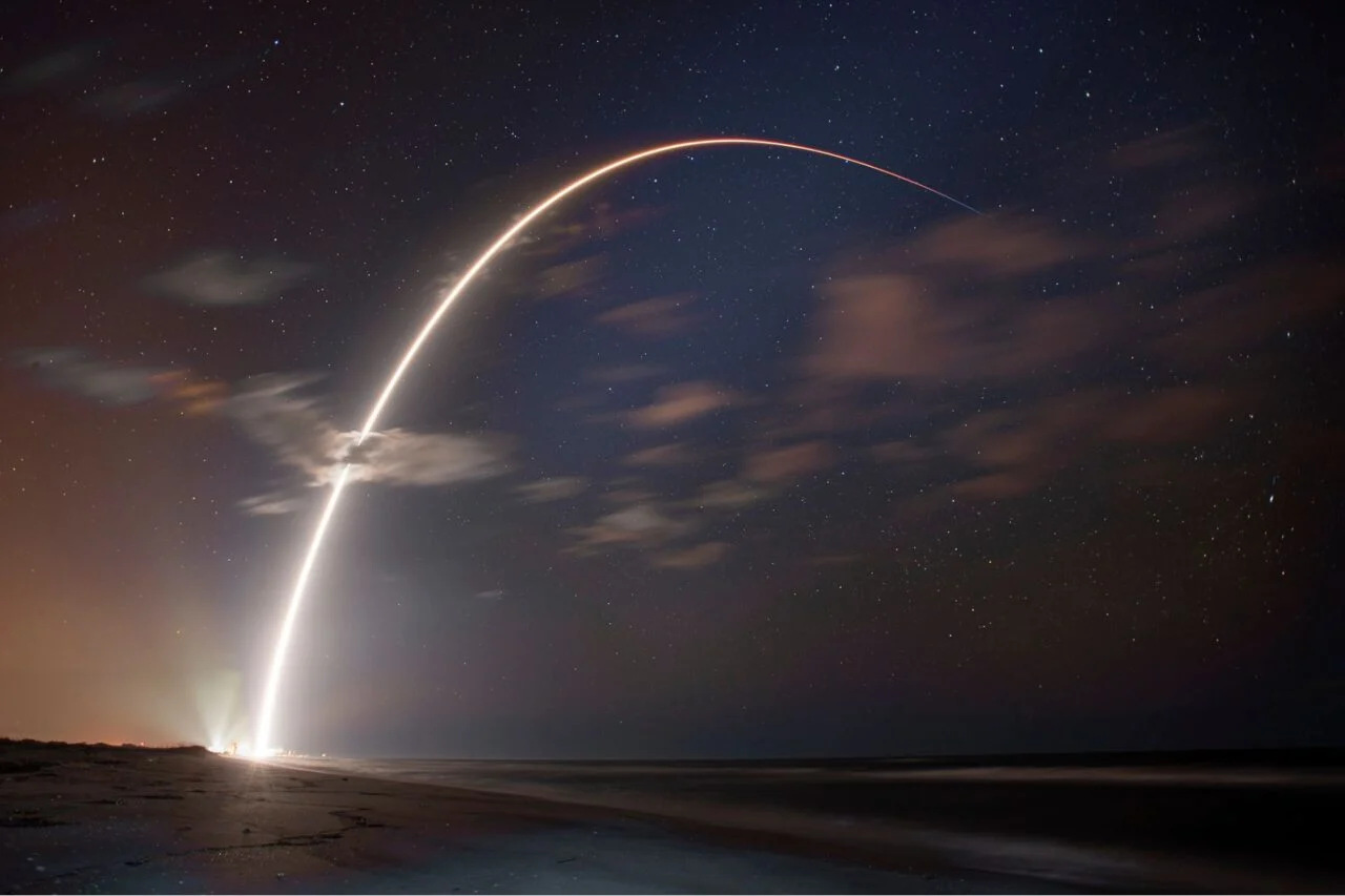 Starlink launch against a starry sky