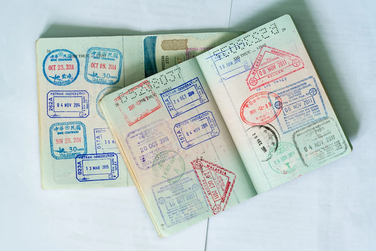 A generic image of a passport with many stamps.