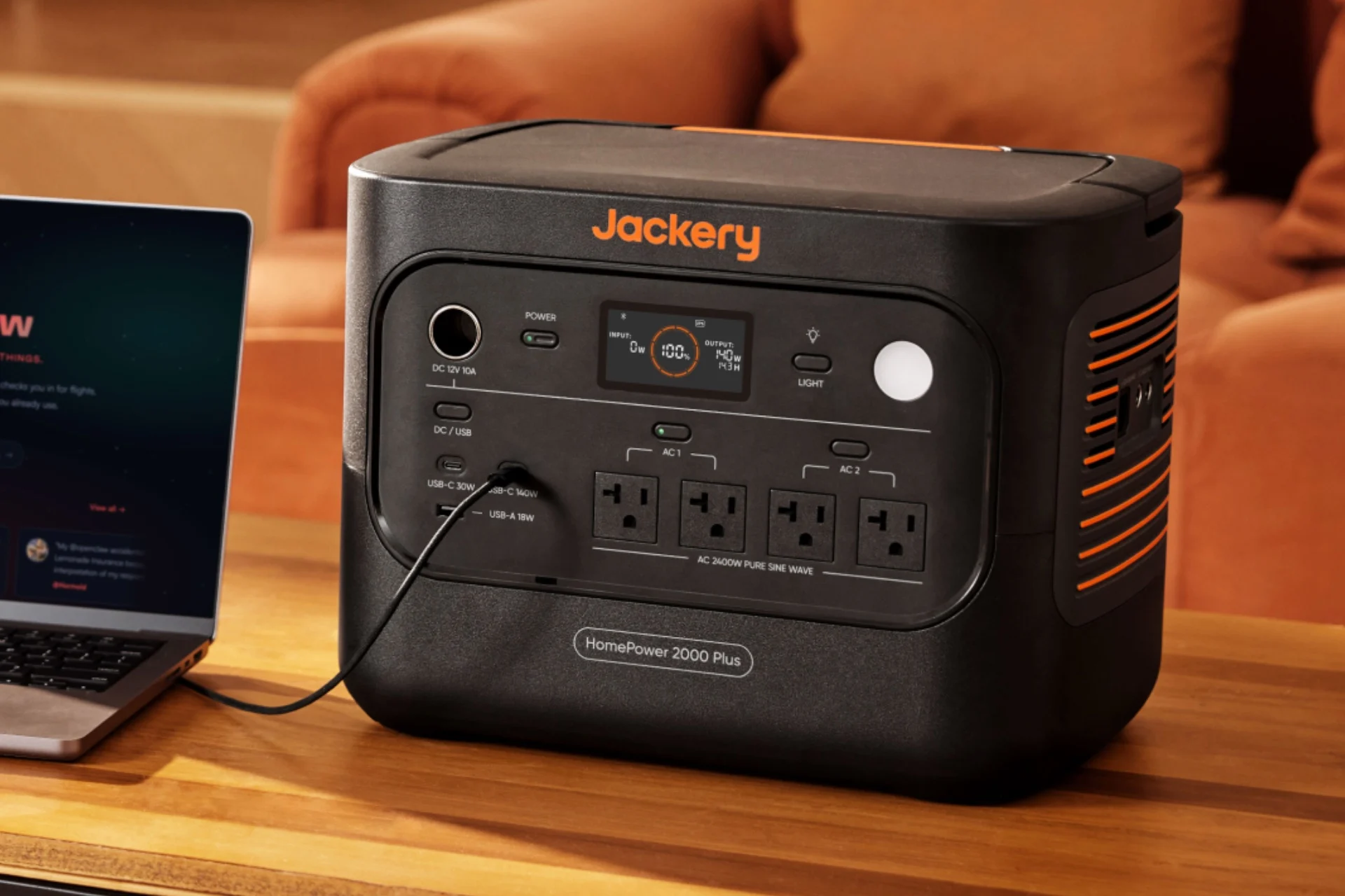 Jackery Homepower 2000 V2 Powering a laptop on a coffee table.