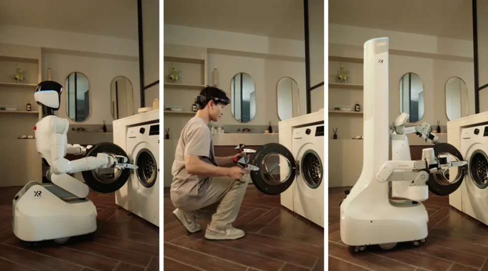 Robot and person loading a washing machine together in a modern laundry room.