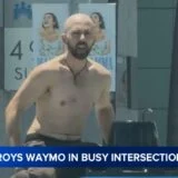 Man destroys Waymo at busy intersection.