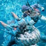 A hunter fights under water.