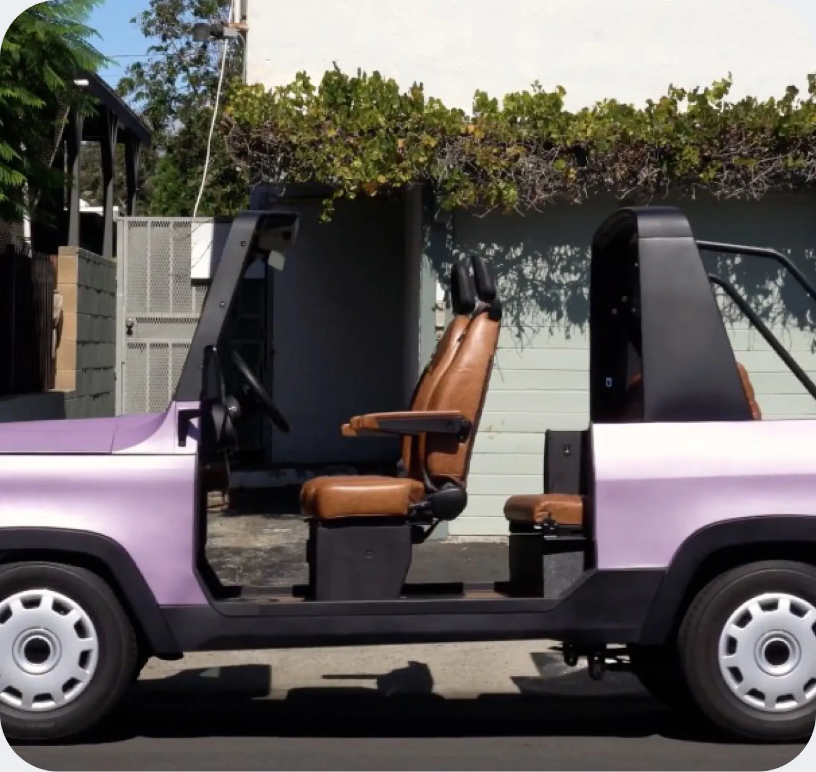 A purple Chip Motors LUV from the side with the doors off
