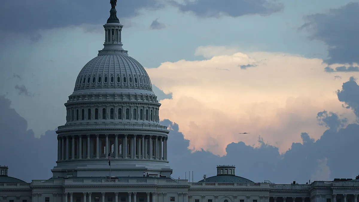 The U.S. Capitol building dome seen against a sky with clouds
