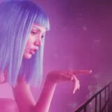 A hologram reaches out to a man.