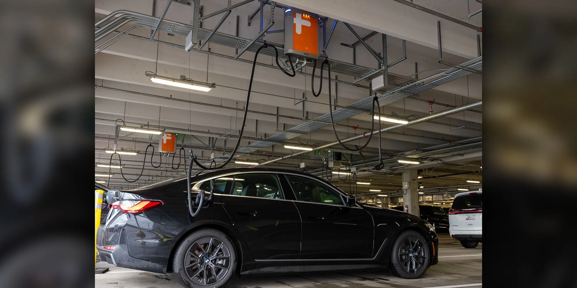 Portland airport can charge 20 rental EVs at once – from overhead